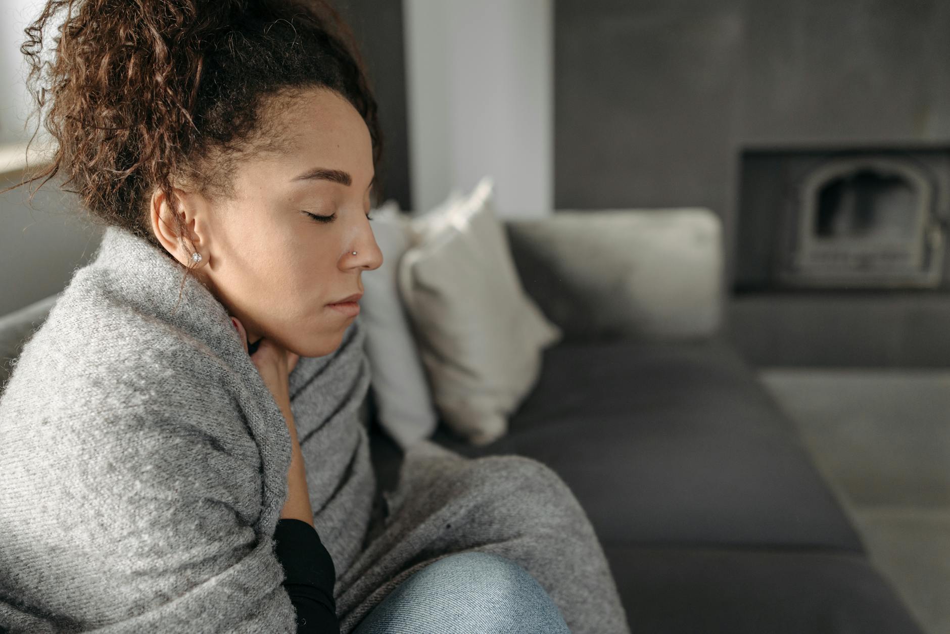 woman feeling cold blanket indoor summer